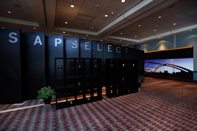Vertical panels separated the SAP Select lounge from a small presentation theater where company executives shared insights with participants.