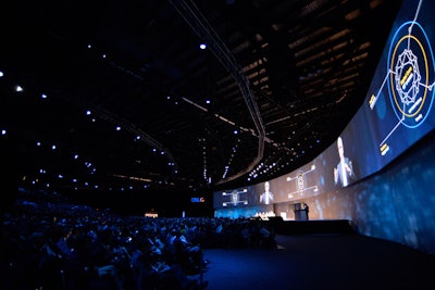 Organizers reconfigured the keynote theater this year, using raked seating to fit 5,500 people in a smaller footprint on the show floor.