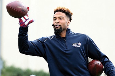 N.F.L. player Odell Beckham Jr. broke a record during Super Bowl XLIX festivities in Scottsdale, Arizona. He snagged 33 one-handed catches in one minute at the Fan Fest.
