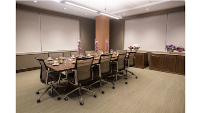 A small dinner party in the executive boardroom.