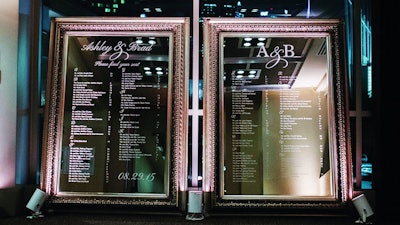 A custom-designed 7.5-foot-tall mirror with escort table names and numbers for a wedding.