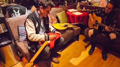 Grammy-winning John Mayer performed an acoustic and blues-rock riffer set and signed guitars for IfOnly.