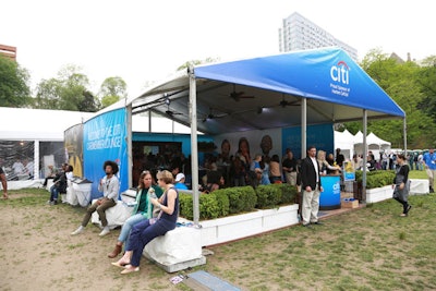 Citi's Cardholder Lounge at Morningside Park featured a bar, high boy tables, charging stations, and lounge seating. Guests could also score swag from a branded vending machine when they posted to their social media accounts.