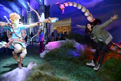 Within Nintendo's exhibit, celebrities like DJ Steve Aoki posed with life-size interactive set pieces that mirrored elements from the game.