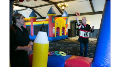 A family fun outing at Mistwood Golf Club with inflatable games in the Great Hall
