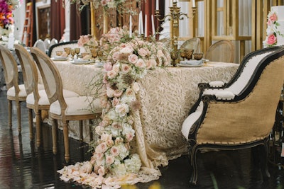 “Gold Metallique” linen from Luxe set a backdrop for a rustic-meets-glamorous look in antique ivory and blush tones at the table known as “Memoirs Of Romance,' designed by Charis Events & Design and Avant Garden Events.