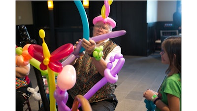A family fun outing with balloon artists in the Great Hall at Mistwood Golf Club