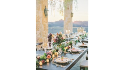 A fresh floral runner was accented with gold sconces at the Malibu Rocky Oaks Estate.