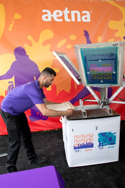 Guests received screen-printed tote bags inside the Aetna tent.