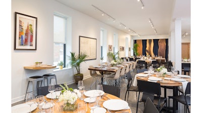 The Showroom on Hubbard's inviting event venue and meeting space set for a dinner party.