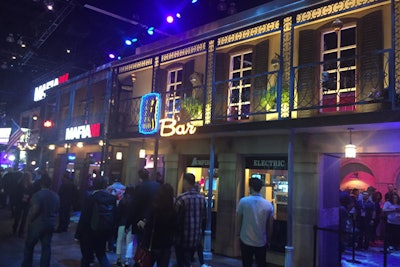 Wrought iron-like detailing decorated the outside of the Mafia III exhibit, creating the look of second-floor balconies over storefronts. Black shutters decorated paned windows, and hanging plants finished the look.