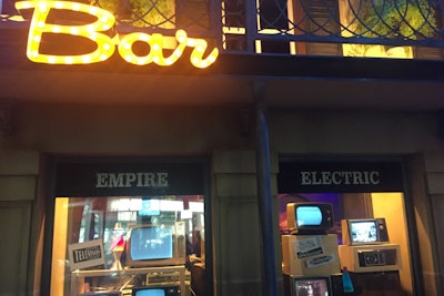 The exhibit's faux storefronts included old-fashioned television sets in a mock electronics store, plus an illuminated sign blazing 'bar.'