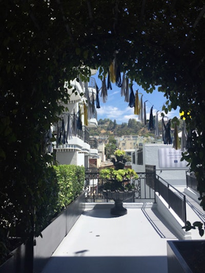 A tassel banner framed the entrance to the rooftop party space, an understated decor element with an air of whimsy.