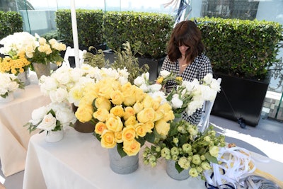 Guests could pick up floral crowns that kept with the tidy yellow and white look of the party's decor.