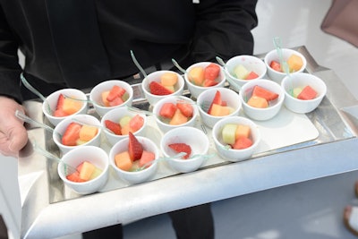 Kid-friendly catering included passed options such as mini corndogs with mustard. But it also included healthy and attractive dishes that appealed to adults as well, such as fresh fruit salad that also made for a colorful presentation.