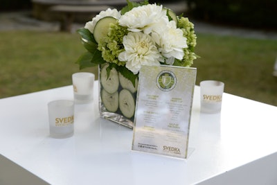 Flower arrangements included lime and cucumber slices lining the walls of glass vessels.