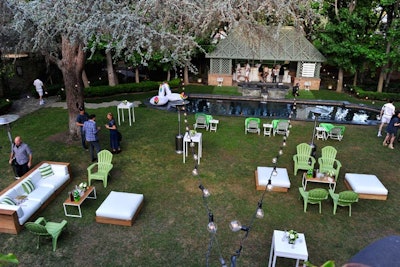 Carnival stringers hung over the green and white party space at a Hancock Park estate.