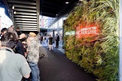 In keeping with the urban jungle theme, the step-and-repeat, located at the base of 14th Street and Tenth Avenue, featured neon signage atop a mixture of explosion grass, cattail grass, lily grass, bear grass, and millet. 'Last year the whole step-and-repeat was clad in leather,' noted Workshop principal Bronson van Wyck. 'This year was more about the small details.'