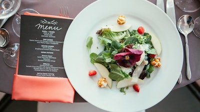 Salad with edible flowers for reception dinner at Room 1520