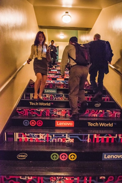 Lenovo's logo and those of some sponsors decorated the stairs that attendees used to go down to the product showcase.