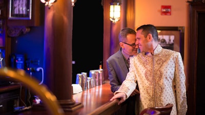 The happy couple get a drink after the ceremony.