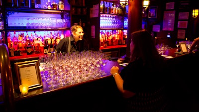 A bartender served wine during a private event.