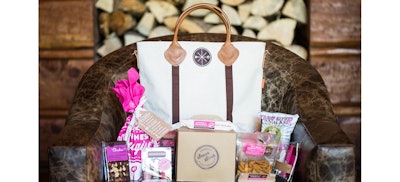 Luxe camp-themed conference welcome bag with snacks and survival supplies