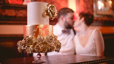 Newlyweds get comfortable in our center booth.