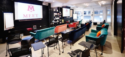 The Salon set up for 45 guests with screens for presentations