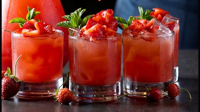 A pitcher and strawberries