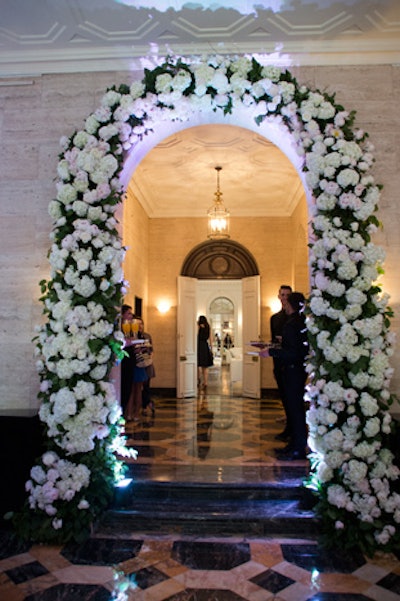 Guests entered the venue through an archway lined with a lush garland of pale blooms. The foyer also included a mural of St. Jude Children’s artwork.