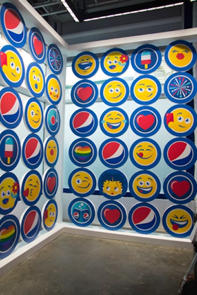 The step and repeat featured an array of PepsiMoji faces, accented by the iconic Pepsi logo.