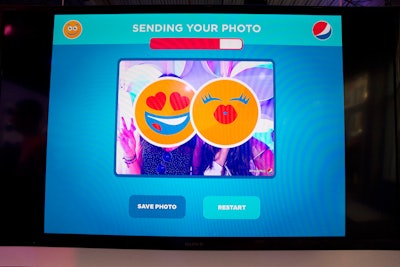 In a custom photo booth, guests were transformed into a range of PepsiMoji designs.