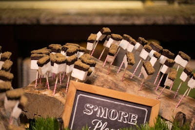 At the Engage! wedding summit held in Colorado in 2014, the event's dessert party offered an easy-to-eat lollipop version of campfire s'mores. (The event's rustic location inspired other various camp-inspired details.)