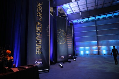 Tall banners, illuminated from the floor, lined the entrance to the 'Agents of the Future' event.