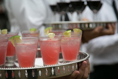 During cocktail hour, servers passed drinks in the dark-pink hues of a sunset. The evening's look was inspired by the sunset over Boulders Beach, which is the native habitat of the endangered penguins that will arrive at the Lincoln Park Zoo in the fall.