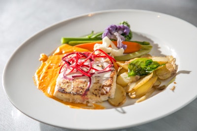 Servers took guests' orders table-side. Options for the entree included roasted halibut (pictured).