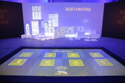 At an interactive projection mapping installation, guests could choose from eight different ways technology might impact cities in the future, such as artificial intelligence and 3-D printing, and then see the effects projected on a cityscape in front of them.