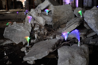 Whimsical bunches of lighting led guests all throughout the venue space.