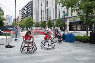 MedStar NRH Punishers Wheelchair Basketball captain Harsh Thakkar (far right) taught wheelchair basketball to local Boys & Girls club members.