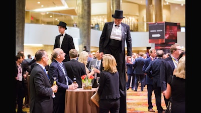 Stilt walkers were invited to help move attendees back into sessions after their breaks.
