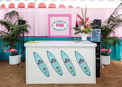 The surfboard motif covered a white bar front.