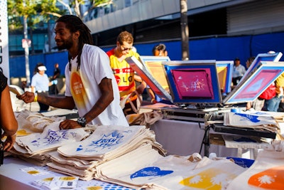 Contained under the shade sail structure was the Pandora swag redemption station, which featured a live-screen printing station providing custom tote bags to guests. Pandora provided game cards to each guest upon arrival. Guests could take the cards to each activation, and get a stamp on their cards after engaging with each sponsor. Once all of the activations were complete, they could redeem the card for a tote, exclusive to the event.