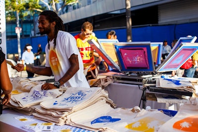 Contained under the shade sail structure was the Pandora swag redemption station, which featured a live-screen printing station providing custom tote bags to guests. Pandora provided game cards to each guest upon arrival. Guests could take the cards to each activation, and get a stamp on their cards after engaging with each sponsor. Once all of the activations were complete, they could redeem the card for a tote, exclusive to the event.