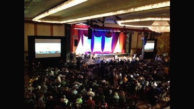 A dual screen with images at the Hilton Hotel