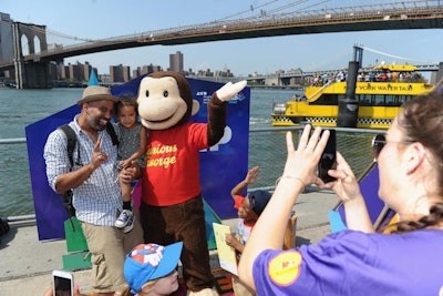 A life-size Curious George mascot was onsite for photo ops.