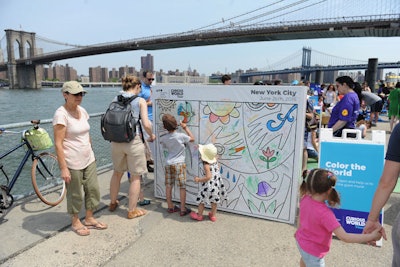 A collaborative mural invited kids to express themselves through art by coloring in Houghton Mifflin Harcourt characters under the direction of a local artist. The murals will be donated to education institutions and organizations that serve families in each local community.