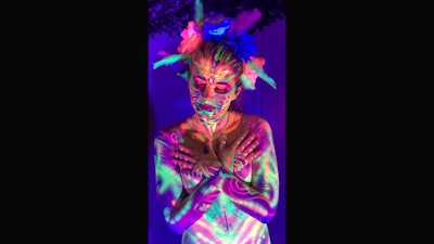 Skin Wars finalist, Lana Chromium, painted models for a black light party.