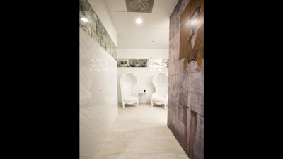 Each bathroom entryway features custom-printed tiles and mirrors from the Bulls’ workout room.