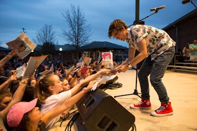Former American Idol contestant MacKenzie Bourg—a native of Lafayatte, Louisiana—is one of the performers at Louisiana Rising: A Benefit Concert for Flood Relief, which will take place in Baton Rouge on Monday. He is shown here during a hometown visit that was televised on American Idol in March.